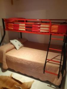 a red bunk bed in a room at Marino114 in Alcossebre