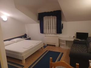 Postel nebo postele na pokoji v ubytování Hotel Ivan Dujmović Dvori + 37 fotografií
