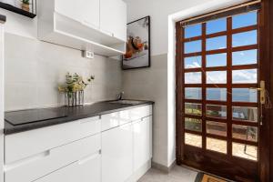 Kuchyň nebo kuchyňský kout v ubytování Apartments Vilma