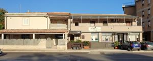 a building with cars parked in front of it at Terra Ciociara BnB in Frosinone