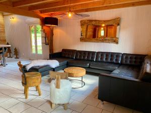 Część wypoczynkowa w obiekcie Gîte Chalet avec bain nordique et piscine 11 pers Hautes Vosges