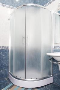 a shower with a glass door in a bathroom at Baku Butik Mini-Hotel in Baku