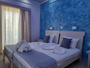 Кровать или кровати в номере Villa Bel Passo Apartments
