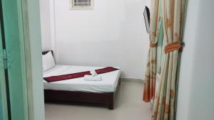 Postel nebo postele na pokoji v ubytování Mango Garden Hoi An Homestay