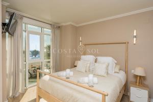 Posteľ alebo postele v izbe v ubytovaní Malaga Benalmadena Puerto Marina Costa Sol Holiday Rentals