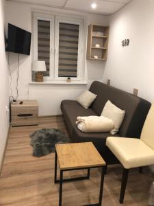 Posedenie v ubytovaní Apartament Mazury