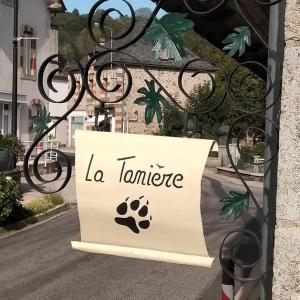 a sign that says la taminate on the side of a street at La tanière in Champs Sur Tarentaine