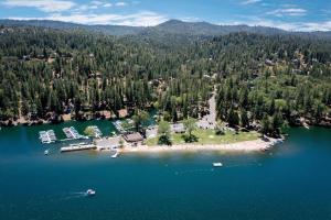 an aerial view of an island in the middle of a lake at New Luxury 5BR Cabin in Pine Mountain Lake! 1 Minute to Beach! Massage Chair! Close to Yosemite! Perfect for Retreats and Escapes All Seasons! in Groveland