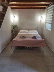 A bed or beds in a room at Elaion Thea2-Nies