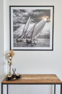 a picture of two sailboats on the water at Vintage breeze Apartment - Spa Pools resort in Mamaia
