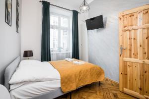 Ліжко або ліжка в номері Royal City Apartments Old Town