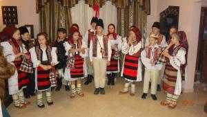 a group of people in traditional clothing posing for a picture at Pensiunea Valcinet in Borşa