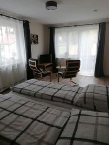 Vuode tai vuoteita majoituspaikassa Pension AdlerHorst