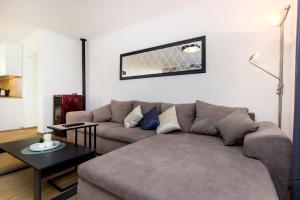 a living room with a couch and a table at Holiday Home Lucia in Lozovac