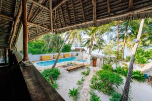 an view of a resort with a swimming pool at Utupoa in Matemwe