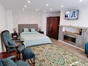 a bedroom with a bed and a fireplace at Casa Do Cais in Setúbal