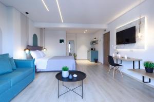 Televízia a/alebo spoločenská miestnosť v ubytovaní 9 Luxury Rooms