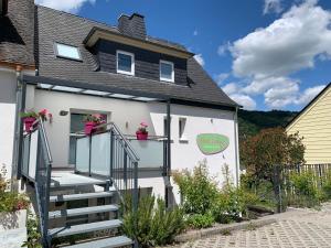 a house with a staircase leading up to it at La Maison Vintage in Cochem