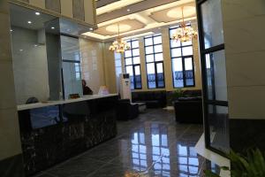 a lobby with a reception desk in a building at HOTEL ANHUI in Lomé