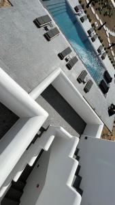 an aerial view of a building with a swimming pool at Naxian Secret in Naxos Chora