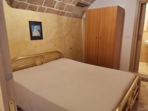 una camera con un letto di Casetta della Purità a Gallipoli
