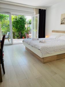 Ένα ή περισσότερα κρεβάτια σε δωμάτιο στο Apartments Paco & Bony