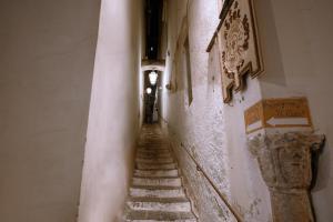 an alley with stairs in an old building at Amalfi Suite Boutique Hotel in Amalfi