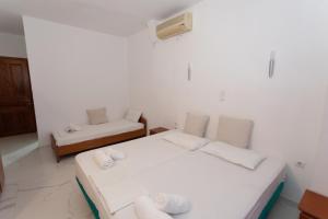 Postel nebo postele na pokoji v ubytování Hotel Philoxenia