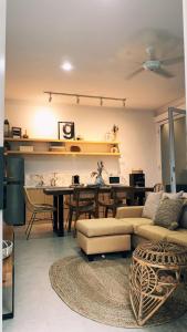 a living room with a table and a couch at Villa Tjokro in Yogyakarta