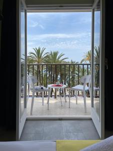 a view of a balcony with a table and chairs at Casual Pop Art Benidorm in Benidorm