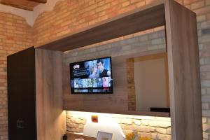 Televízia a/alebo spoločenská miestnosť v ubytovaní Elegante Casa Mafalda con vista