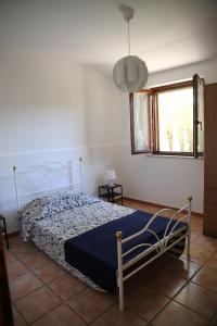 A bed or beds in a room at Appartamenti il PALAZZACCIO