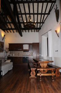 a living room with a table and a couch at La dimora del ghibellino in Tivoli +38 photos
