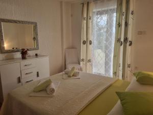 Postel nebo postele na pokoji v ubytování Apartment Rita