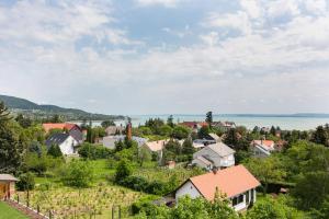 a small town with a view of the water at Flow House&Garden in Badacsonytomaj