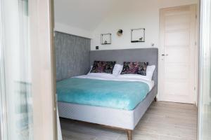 מיטה או מיטות בחדר ב-Flow House&Garden