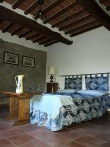 Postel nebo postele na pokoji v ubytování Il Fico di Cortona