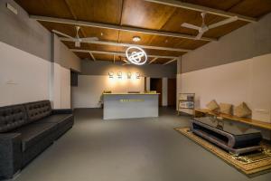 a living room with a couch and a table at Shine Residency in Mysore