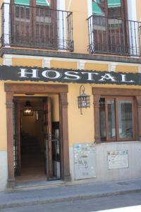 a building with a sign that reads hos at Hostal Maria Ronda in Madrid