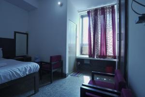 Voodi või voodid majutusasutuse Hotel Sumitra BY WB Inn toas