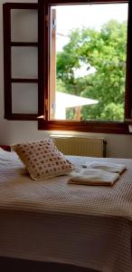 A bed or beds in a room at On the road house