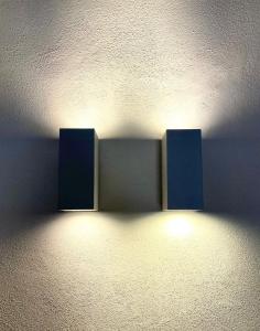 two lights are on a wall in a room at Dimora delle Tonnare in Favignana