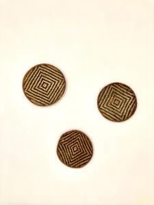 two brown cookies sitting on top of a table at Dimora delle Tonnare in Favignana