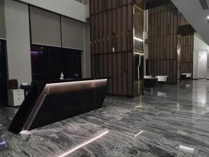 a large lobby with a reception desk in a building at Sky pool 4 star hotel grade stay in i-City in Shah Alam