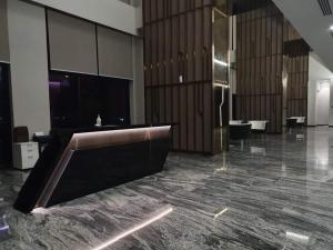 a large lobby with a reception desk in a building at Sky pool 4 star hotel grade stay in i-City in Shah Alam +6 photos
