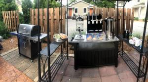 a patio with an outdoor kitchen and a grill at Bodee's Bungalow Adults Only Couples Only Boutique Hotel in Put-in-Bay
