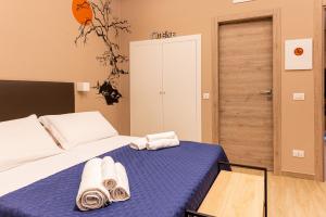 Posteľ alebo postele v izbe v ubytovaní ASTARE -short lets in bari carrassi-
