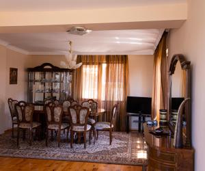 a dining room with a table and chairs at Guesthouse Gaby in Sapareva Banya