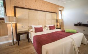 Postel nebo postele na pokoji v ubytování Bennoc Petit Hotel - Only Adults