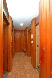 a hallway with wooden walls and a hallway with a hallway at Apartment Sky Cervinia in Breuil-Cervinia